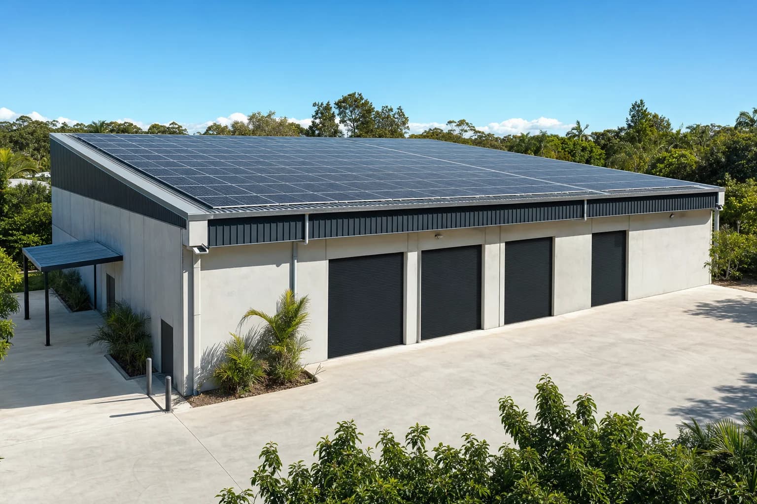 Solar array on the roof of a Gold Coast commercial warehouse building under clear sky